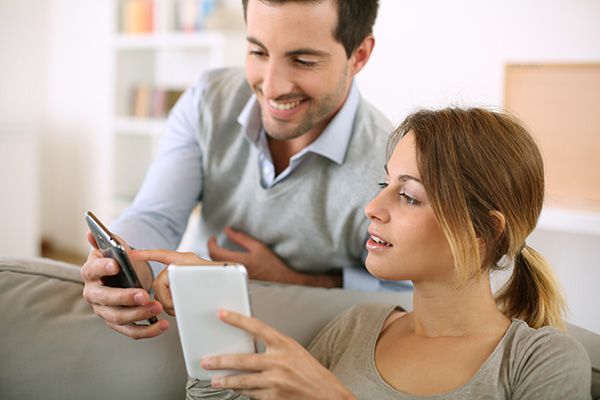 Couple smiling at phone